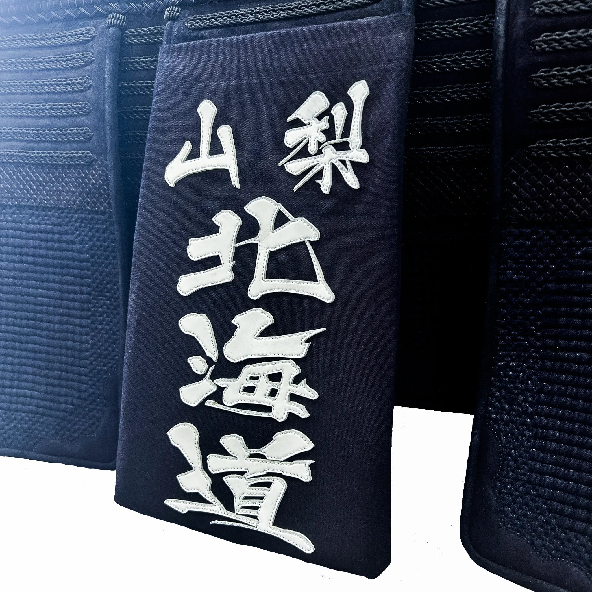 帯に付けられた名札