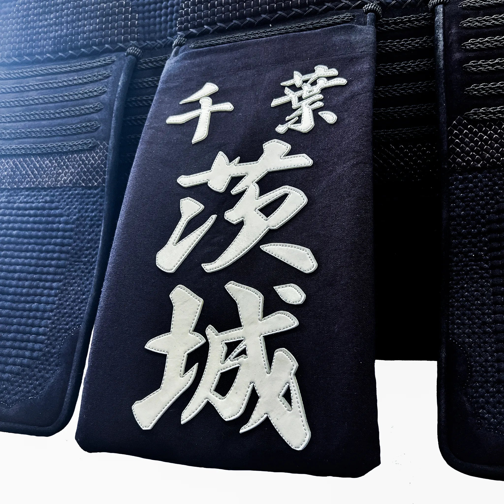 帯に付けられた名札