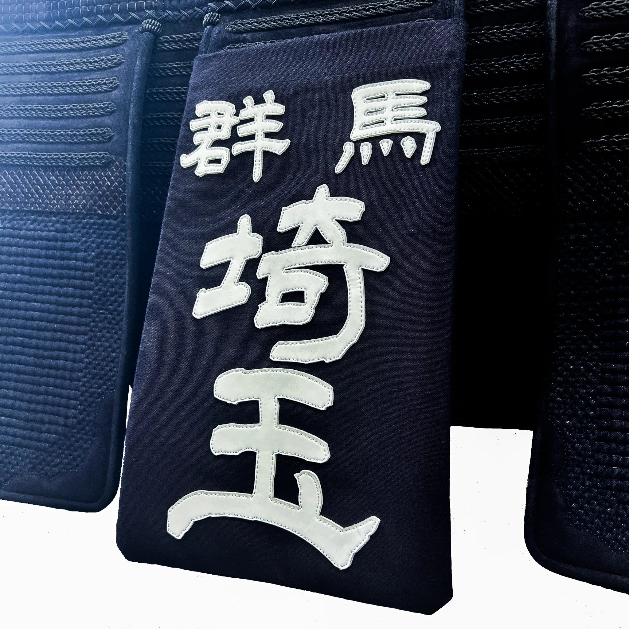 帯に付けられた名札