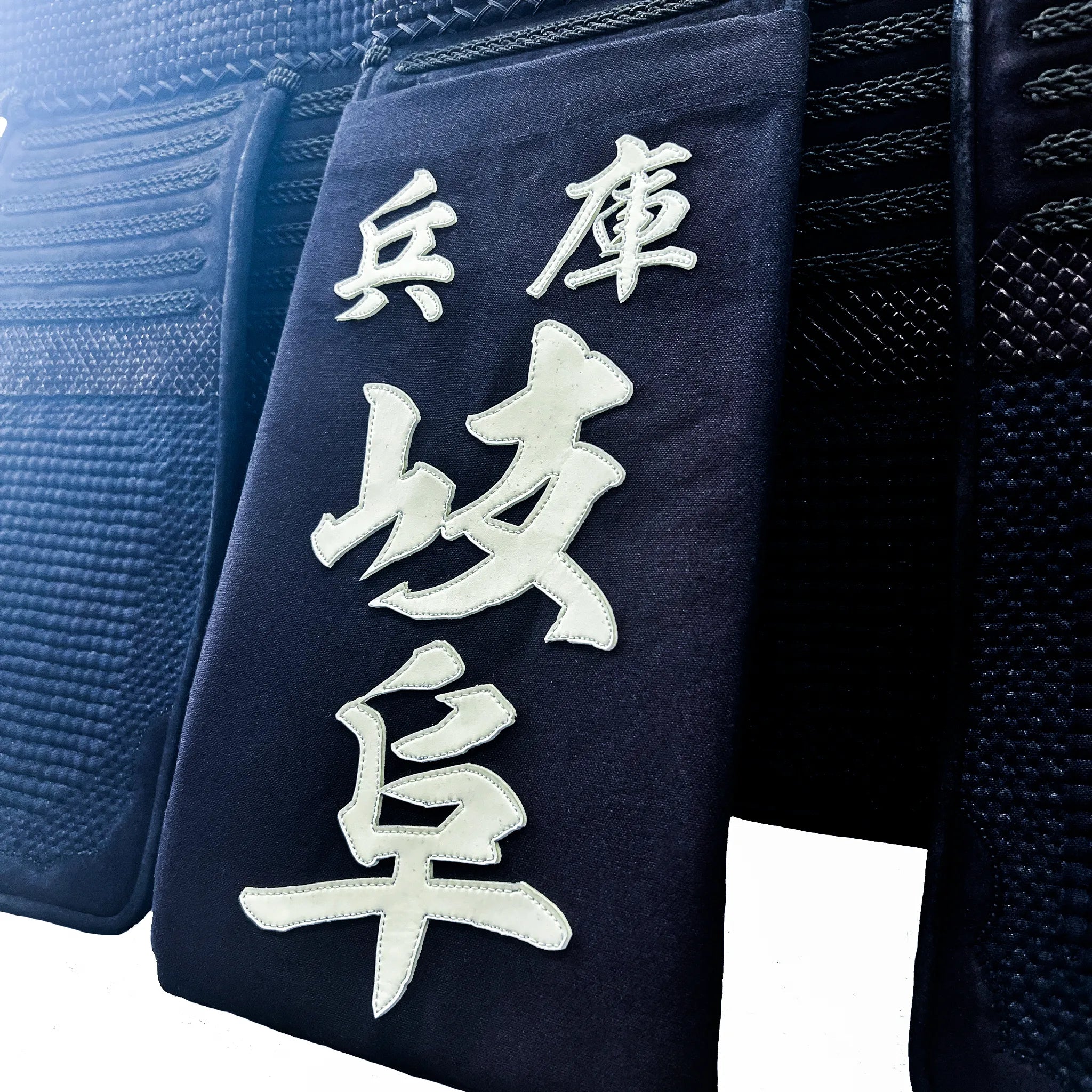 帯に付けられた名札